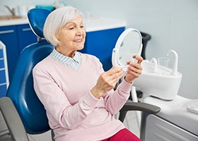 Woman smiling in the dental chairs