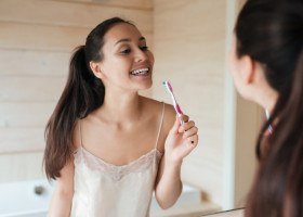 Woman brushing her teeth