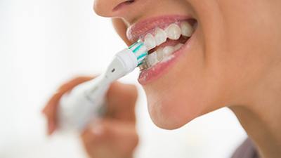 Woman brushing her teeth