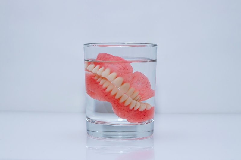 Dentures soak in clear liquid